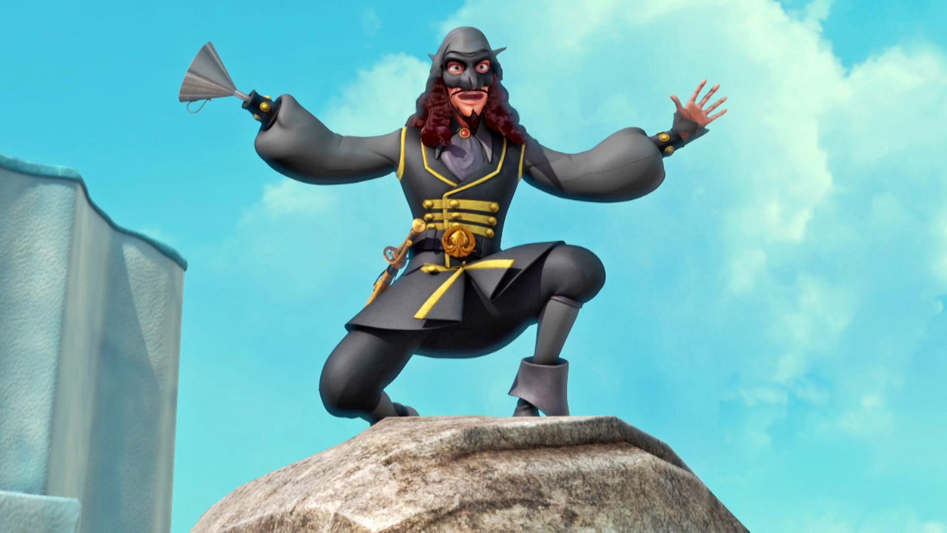 Der ganz in schwarz und mit Maske gekleidete El Hookato steht auf einem Felsen. Er reißt seine Arme hoch und hält eine erschreckende Pose inne.