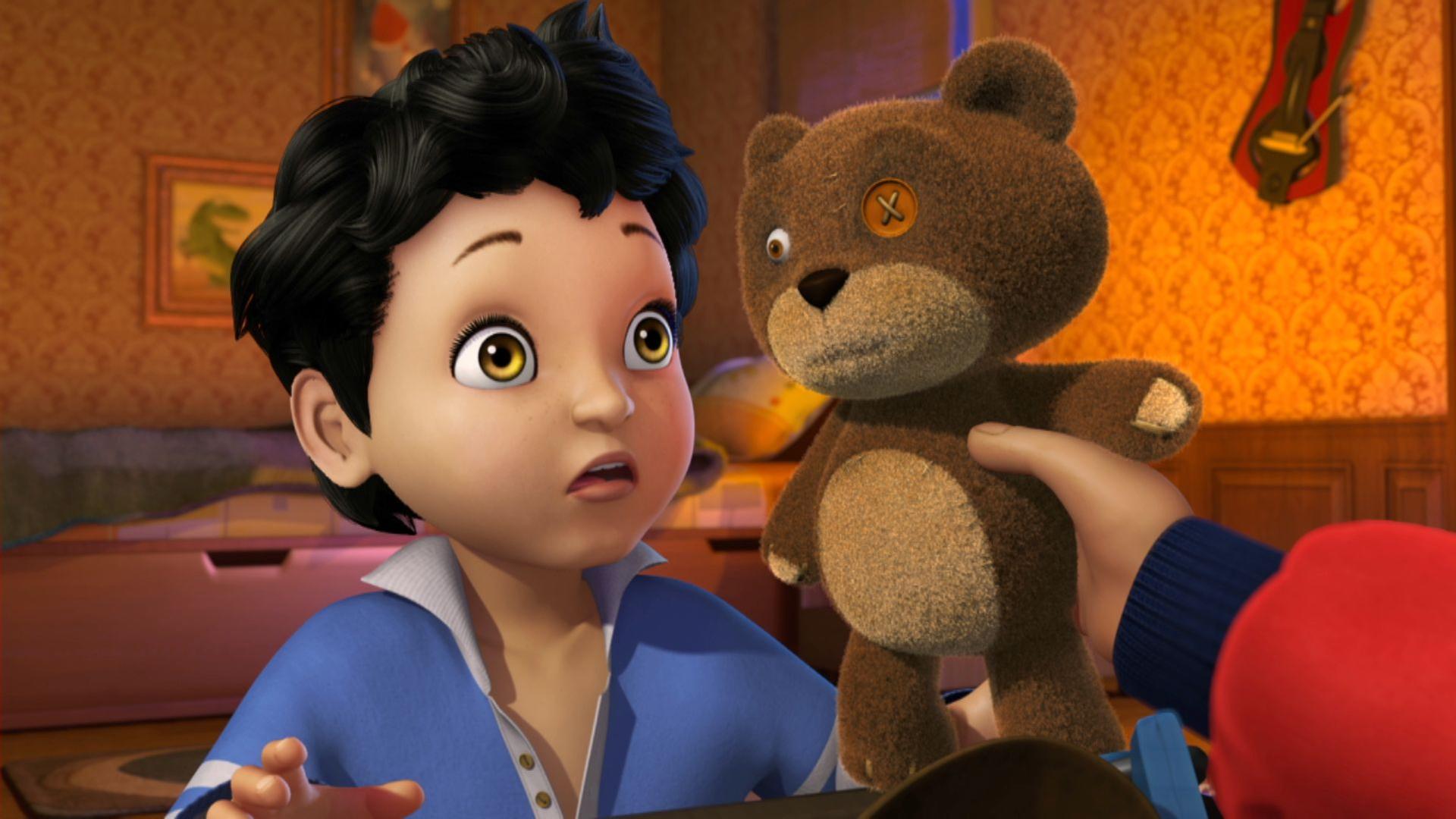 Michael (links) wird sein Teddybär Nono gereicht.