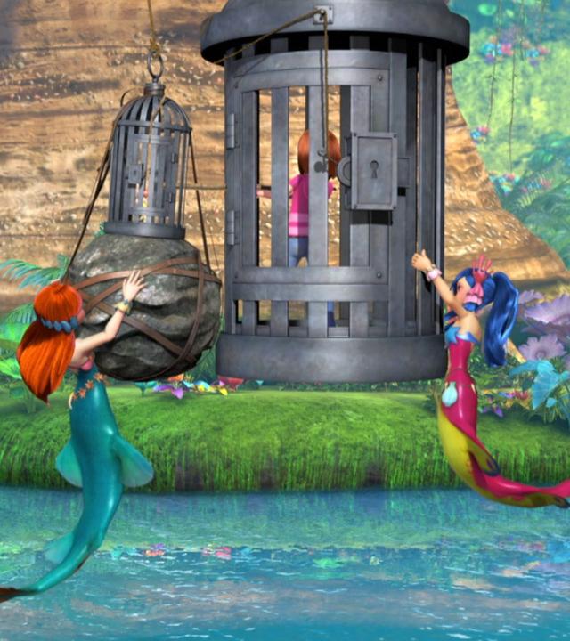 Zwei Käfige hängen über dem Fluss. In ihnen befinden sich Wendy und Tinkerbell. Zwei Meerjungfrauen versuchen sie zu befreien, während Hook und Peter Pan im Hintergrund zuschauen.