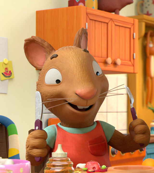 In der Küche: Posy, die Maus, und ihr bester Freund Pip, das Kaninchen, stehen nebeneinander. Beide haben Gabel und Messer in ihren Händen und machen sich freudig dreinblickend bereit ihre leckeren Pfannkuchen, die vor ihnen stehen, zu essen. Pip hat auf seiner Nase einen roten Marmeladenklecks.