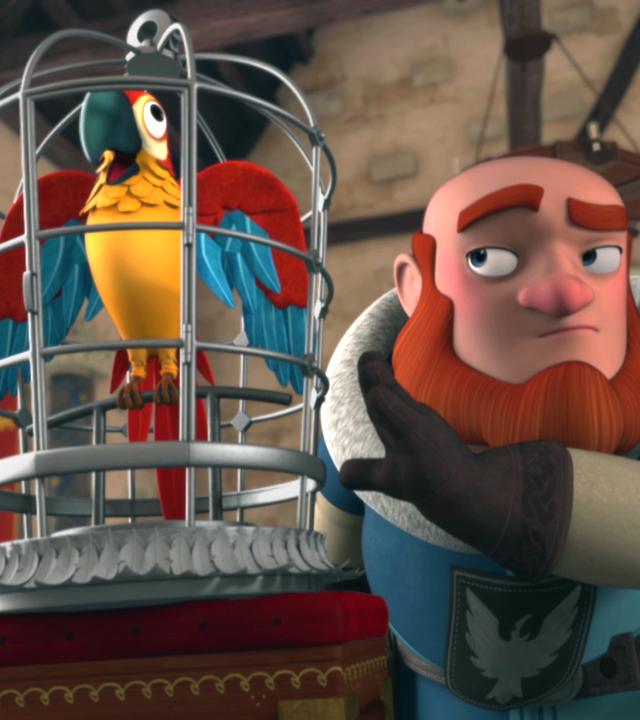 Lord Gudfred hält einen Käfig mit einem bunten Papagei hoch. Der Papagei krächzt.