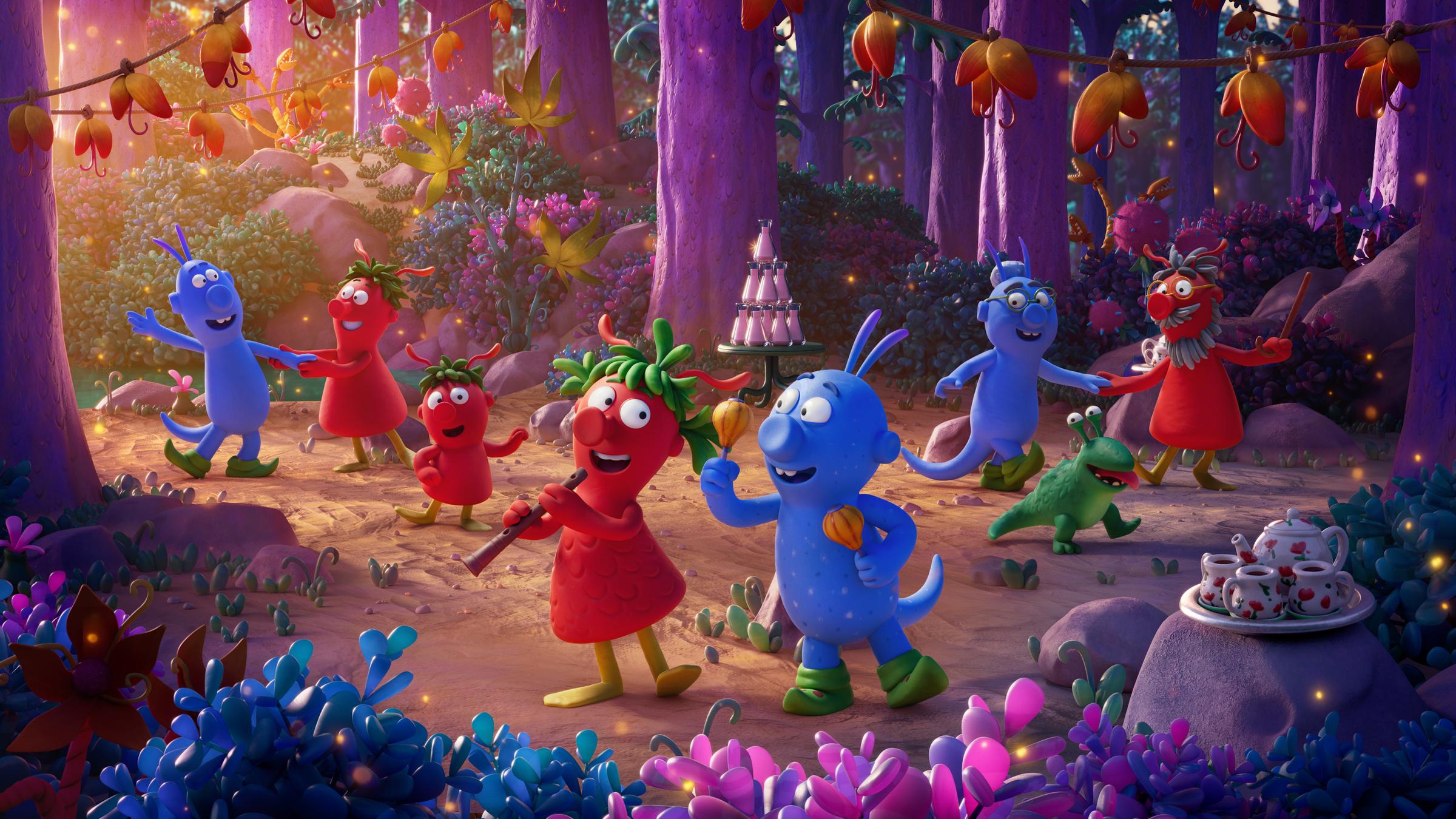 "Die Schnetts und die Schmoos": Grete und Bernd tanzen nebeneinander. Grete hat eine Flöte in ihren Händen die sie zum Mund führt und Bernd hält jeweils eine Rassel in jeder Hand. Sich lachen sich gegenseitig glücklich an. Im Hintergrund tanzen weitere Schnetts und Schmoos, die ebenfalls glücklich lächeln.