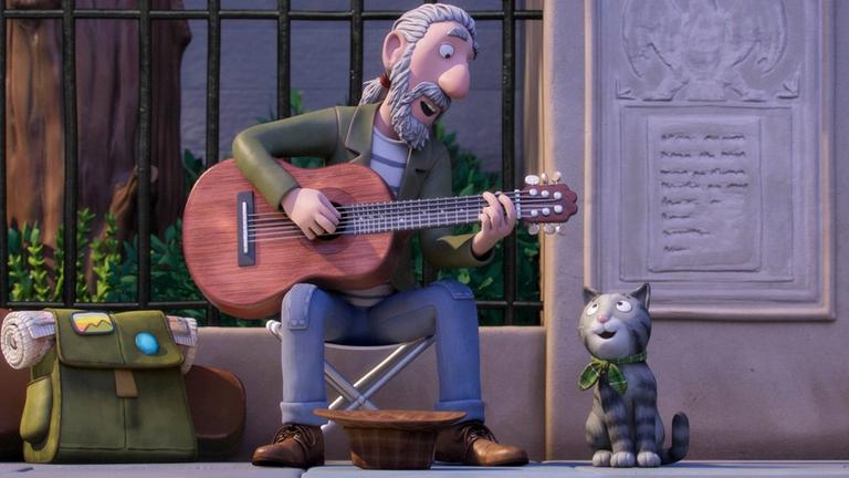 "Tommi Tatze":  Straßensänger Matze sitzt auf einem Klapphocker auf der Straße und spielt Gitarre. Nebe ihm sein Kater Tommi Tatze