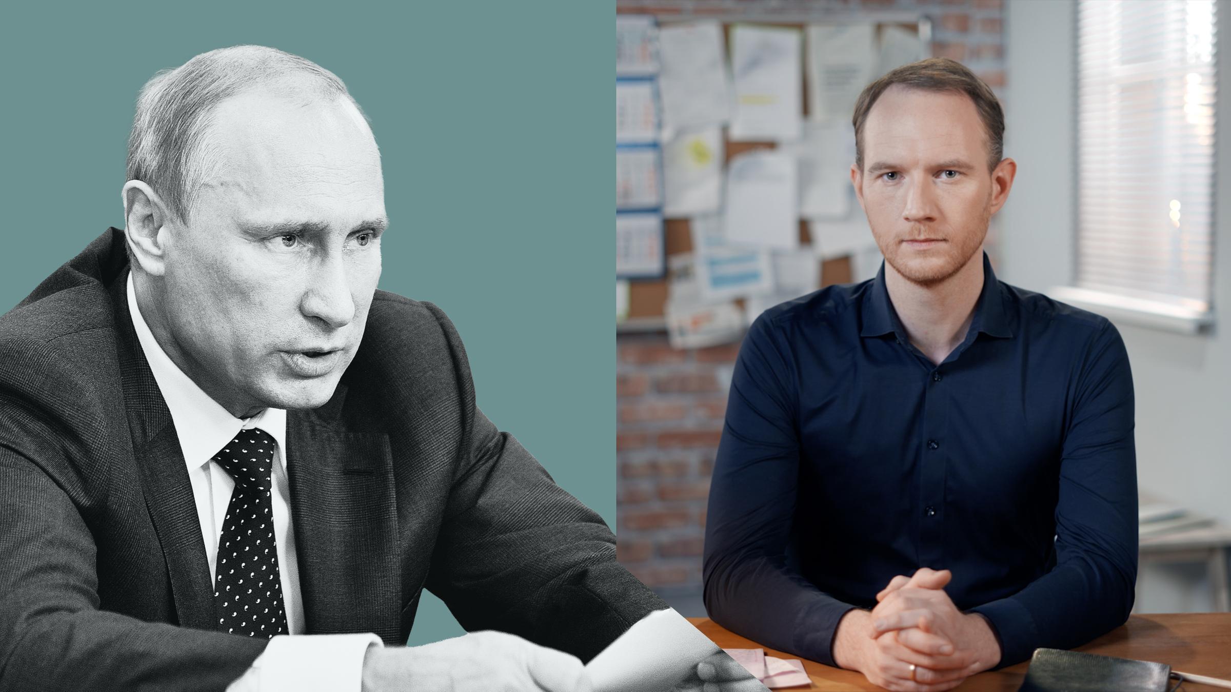 Russlands Präsident Wladimir Putin sitzt im Kreml alleine an einem langen Tisch.