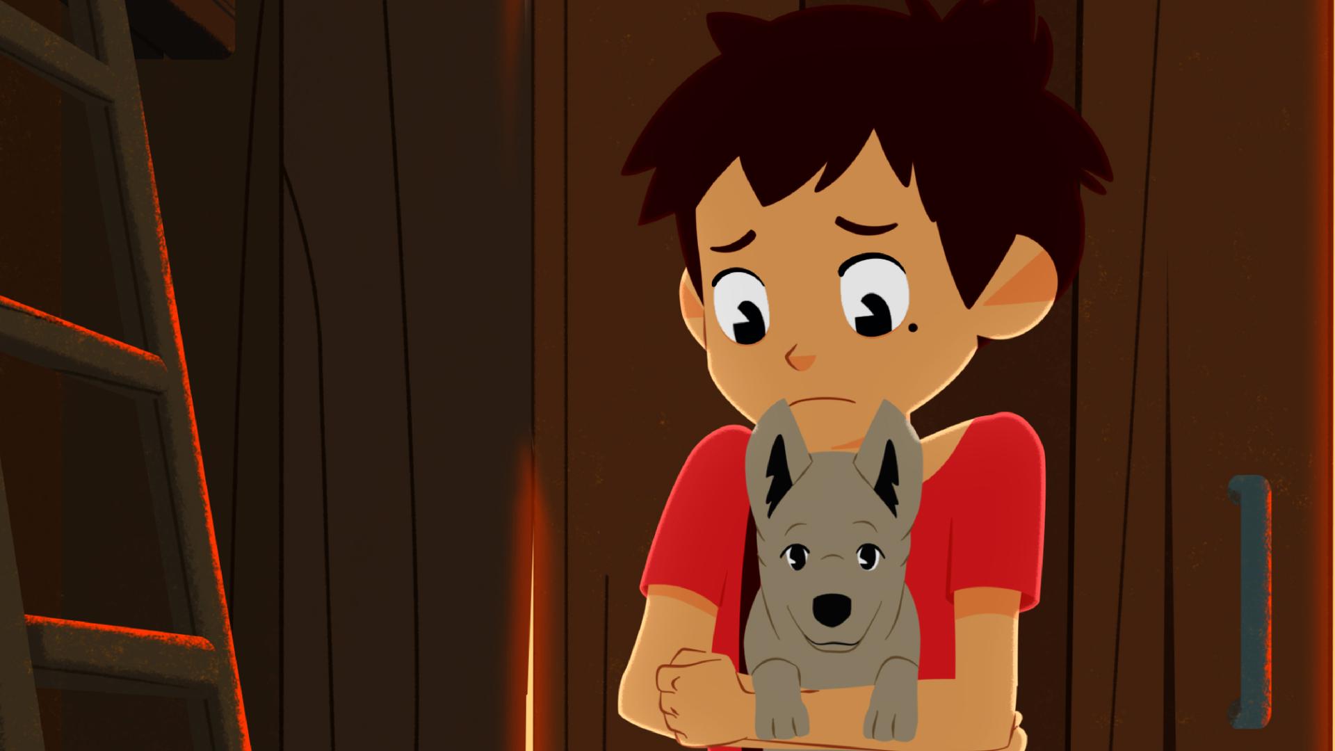 Sebastian hat einen Welpen auf dem Arm und guckt ihn besorgt an.