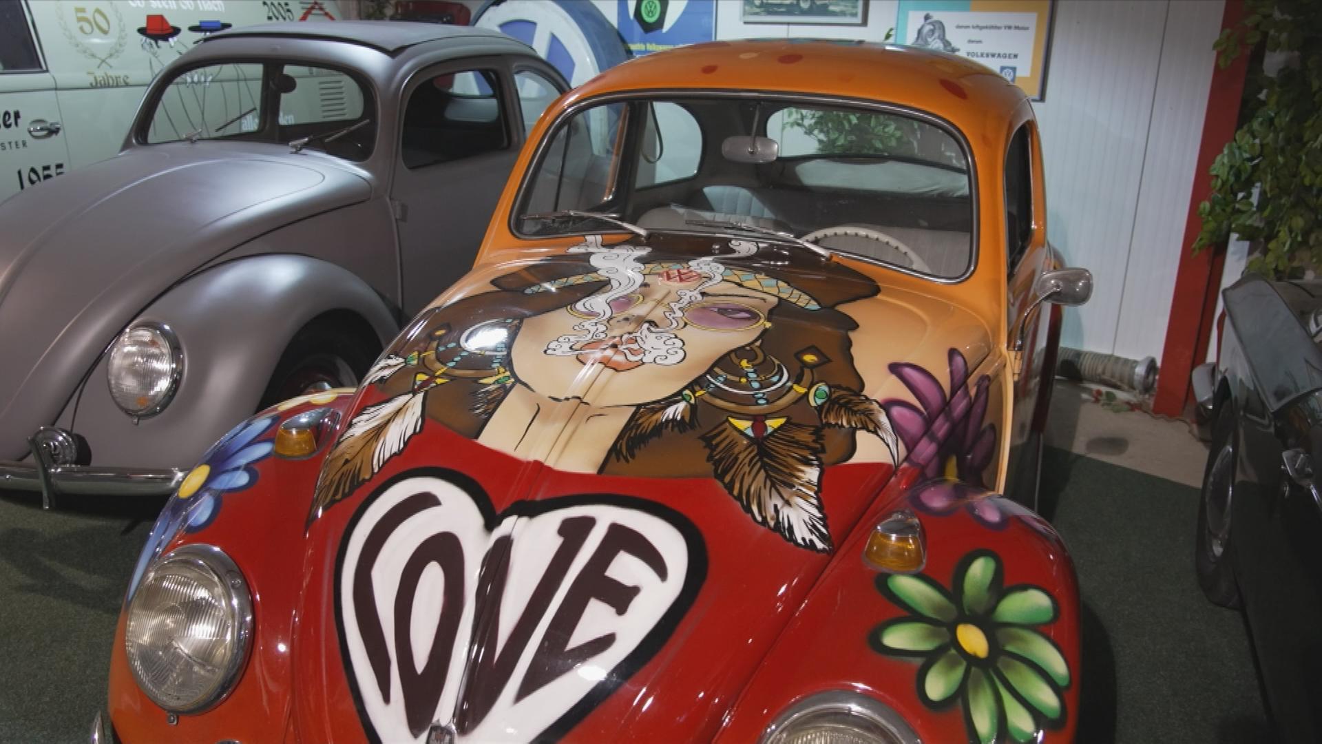 VW-Käfer mit Grafitti bemalt