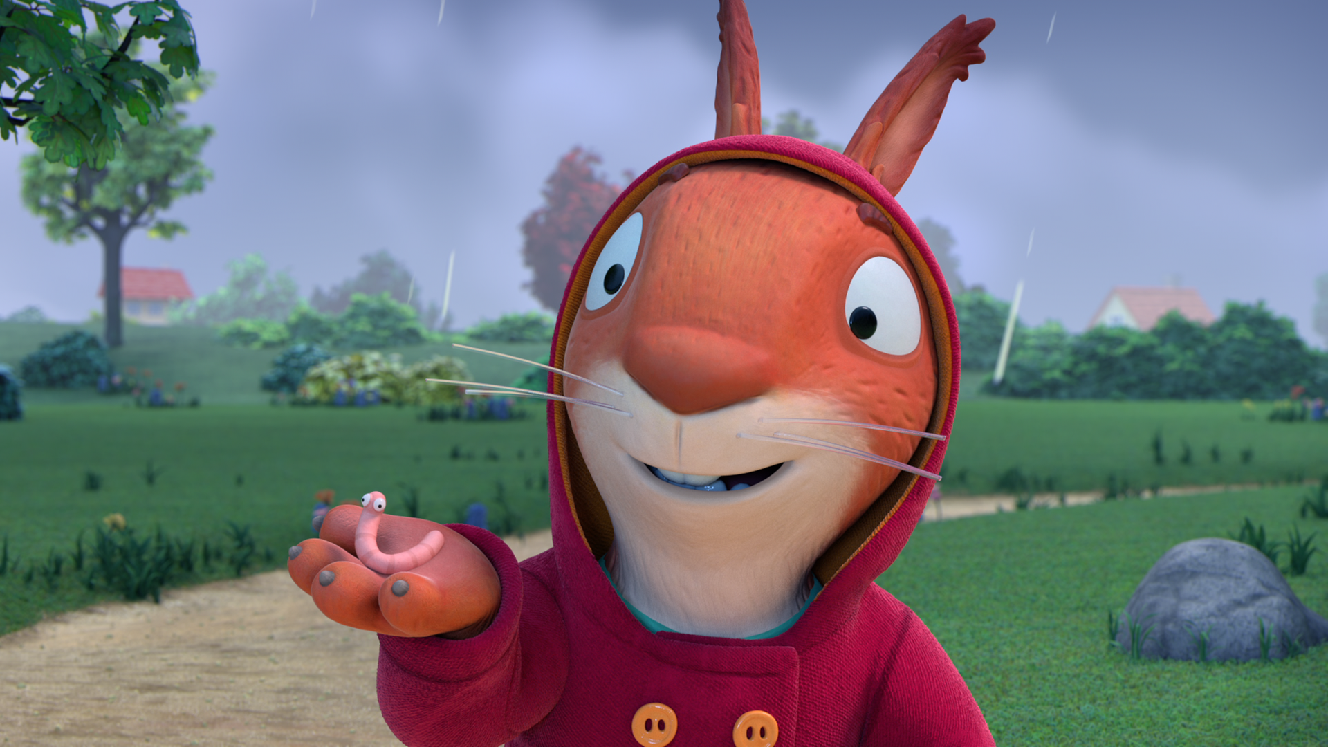 Jamila hält begeistert einen Regenwurm in der Hand und zeigt ihn Pip und Posy. Im Hintergrund sind dunkle Wolken zu sehen, es regnet.