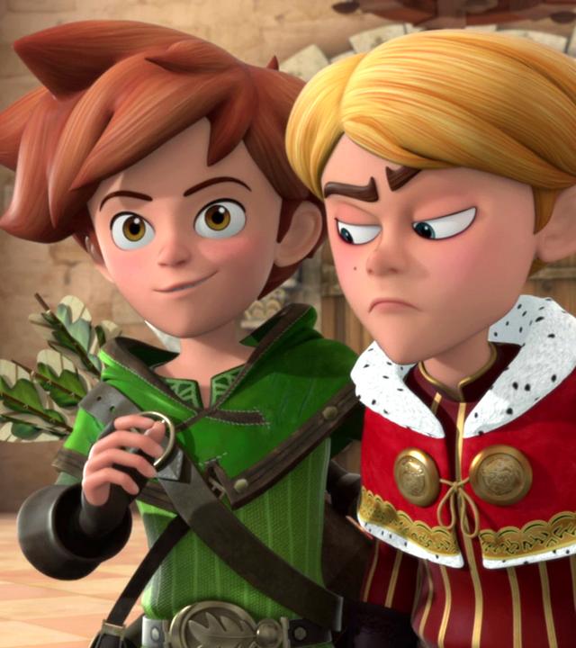 Robin legt einem grimmig aussehnden Prinz John seinen Arm um die Schulter. Die beiden stehen im Schloss.