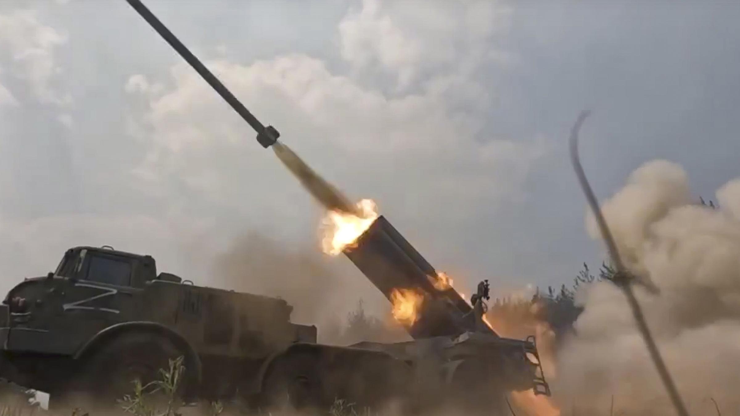 Russian military multiple rocket launcher launches rockets at Ukrainian troops at an undisclosed location.