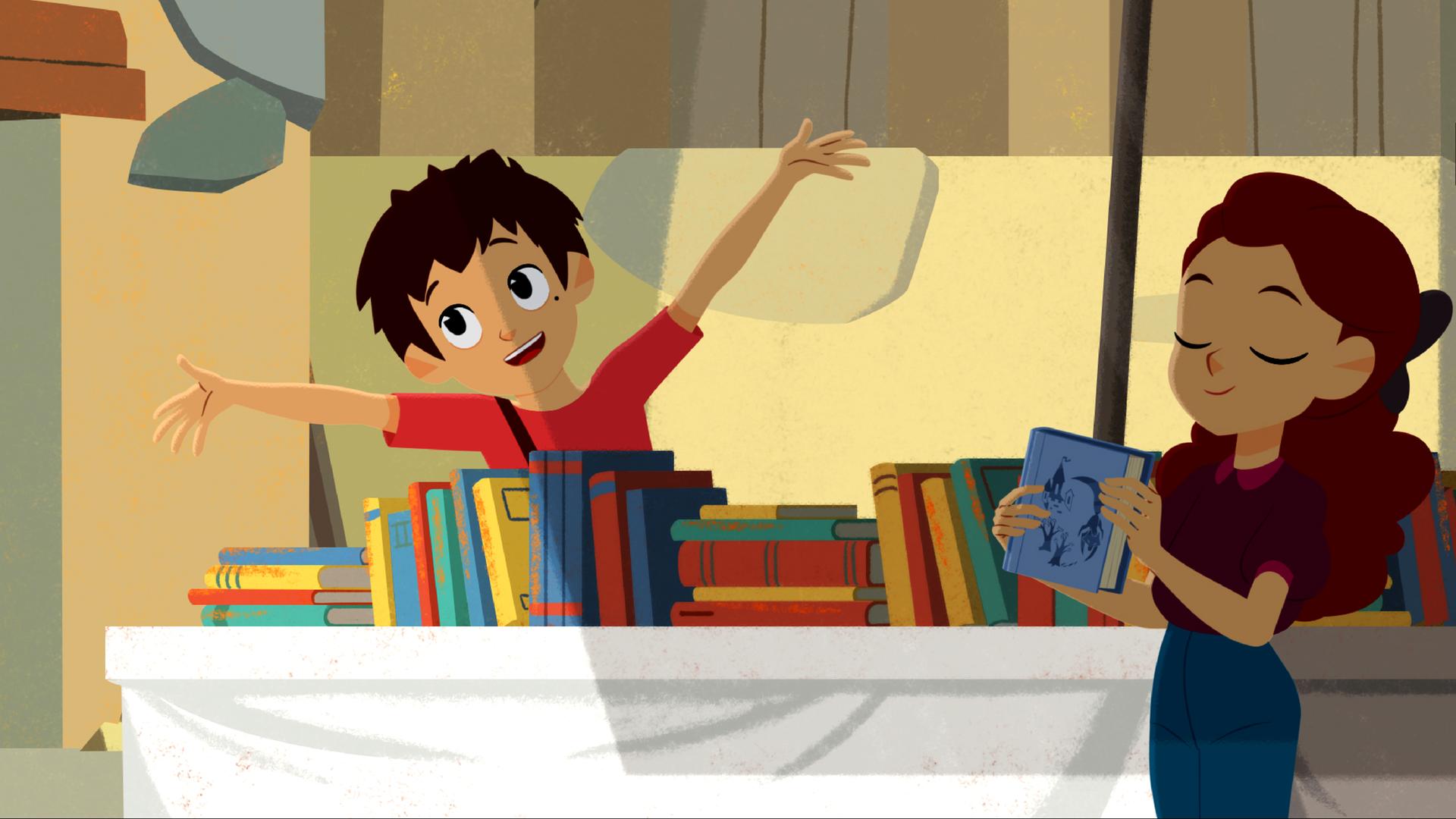 Sebastian steht hinter einem Tisch voller Bücher und wirft fröhlich die Arme nach oben. Adele steht davor und hält ein Buch in der Hand.