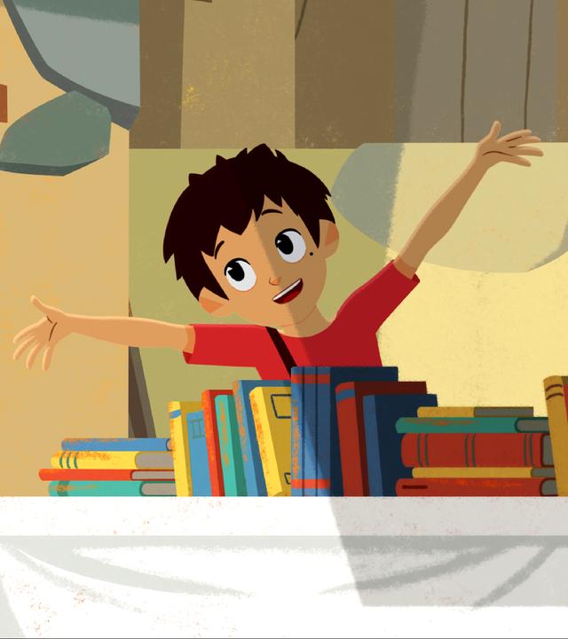 Sebastian steht hinter einem Tisch voller Bücher und wirft fröhlich die Arme nach oben. Adele steht davor und hält ein Buch in der Hand.