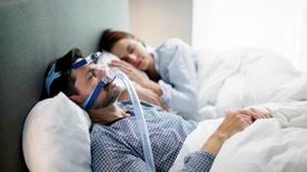 Person wearing a CPAP mask for sleep apnea