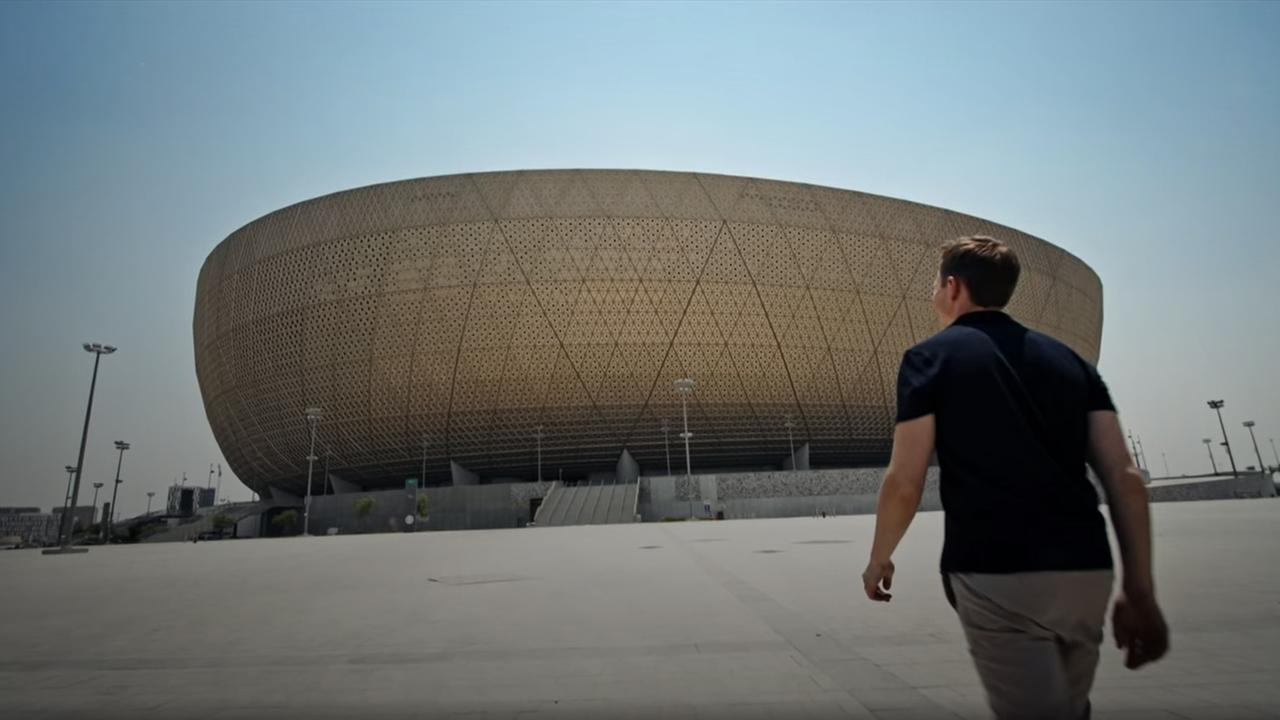 ZDF presenter Jochen Breyer in front of a large stadium in Qatar November 7, 2022