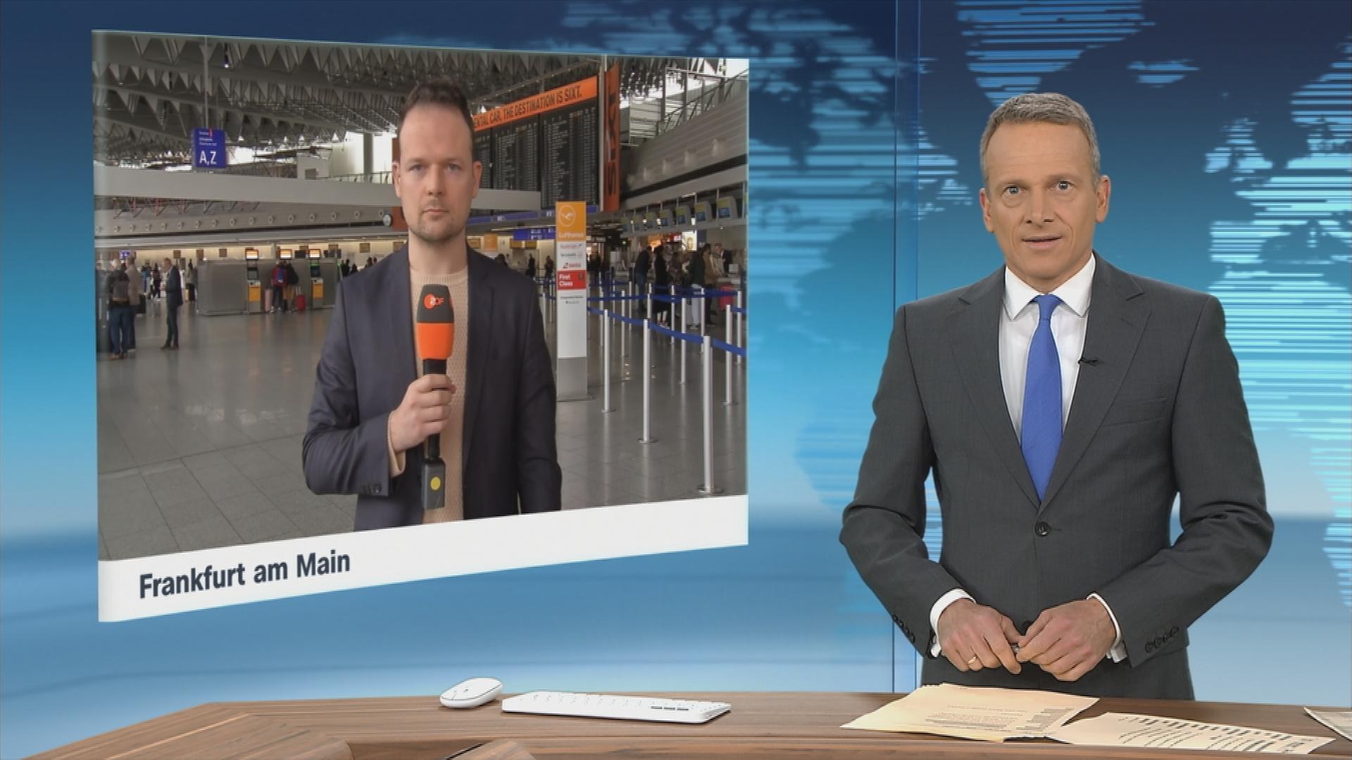 ZDF-Reporter Markus Wolsiffer, zugeschaltet vom Frankfurter Flughafen im Gespräch mit Moderator Carsten Rüger im Studio.