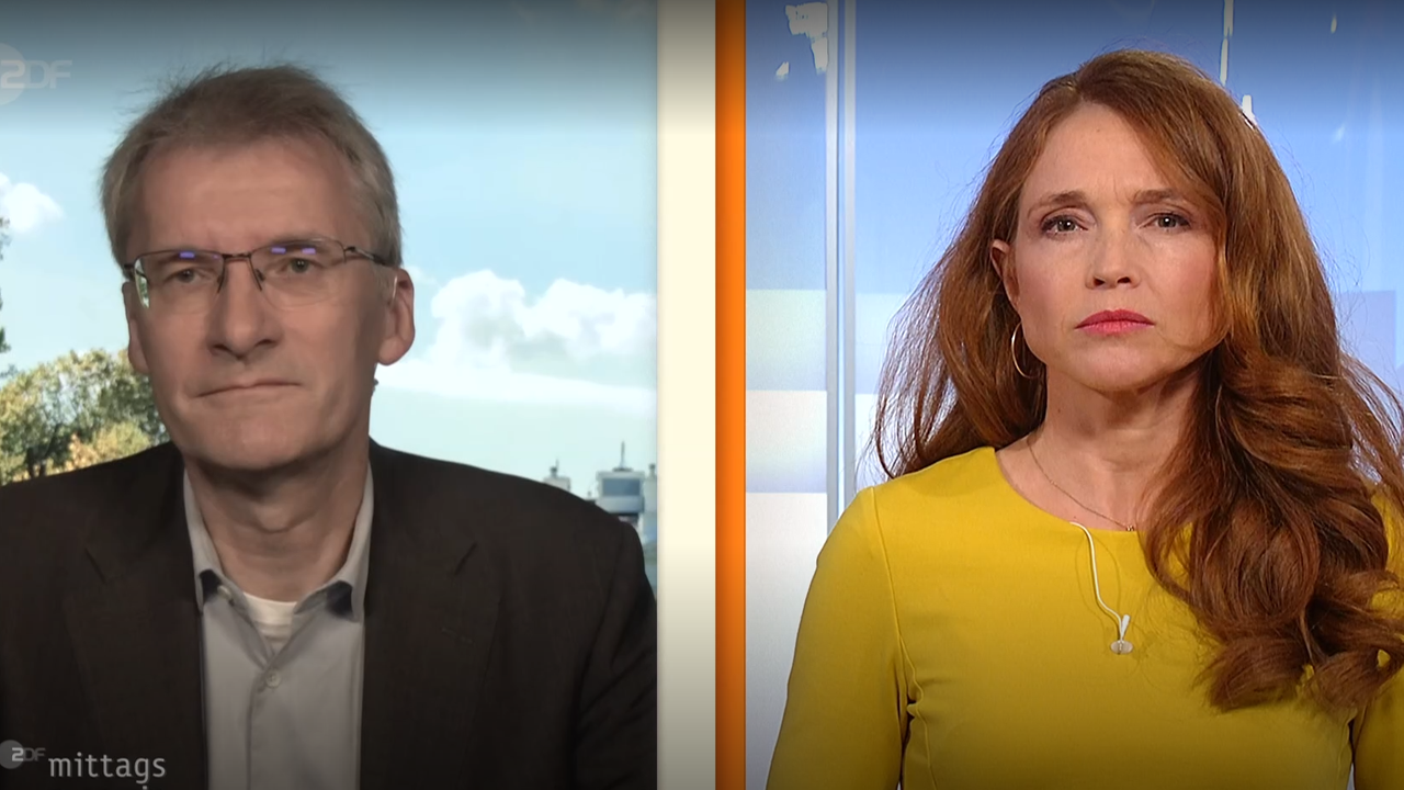 Elmar Theveßen und Mirjam Meinhardt im Schaltgespräch.