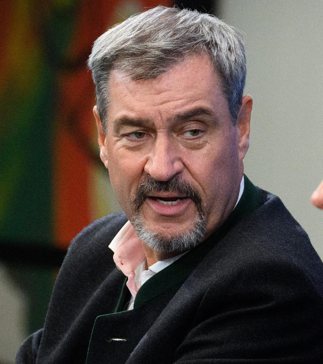 Markus Söder (CSU), Kanzler Friedrich Merz (CDU), Arbeitsministerin Bärbel Bas (SPD) und Lars Klingbeil (SPD) treten gemeinsam bei einem öffentlichen Termin auf.