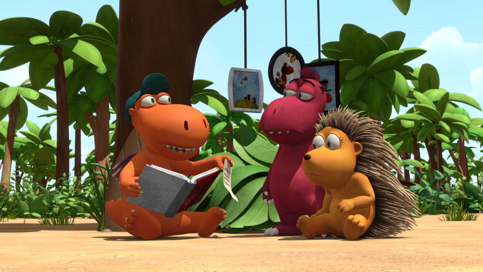 Kokosnuss liest Oskar und Matilda aus einem Buch vor.