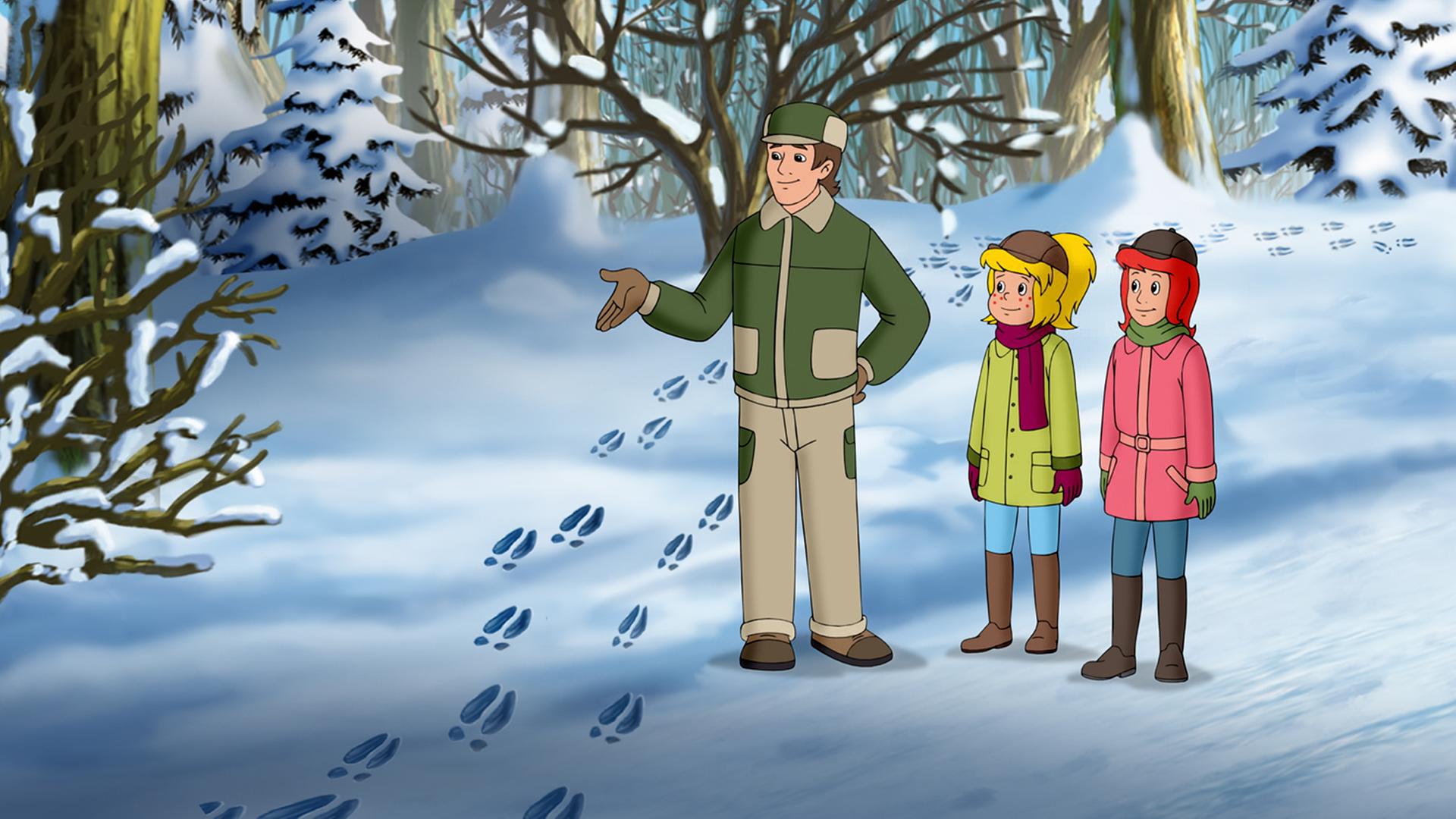 Der Förster zeigt Bibi und Tina frische Spuren im verschneiten Wald.