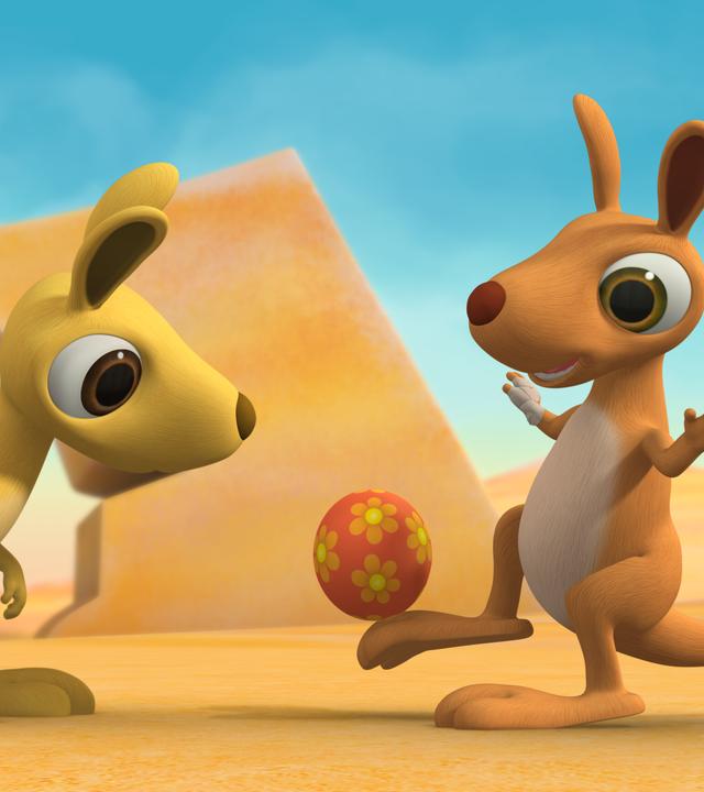 Die Känguru-Geschwister Karli und Klara vertragen sich wieder. Klara spielt mit einem roten Ball.