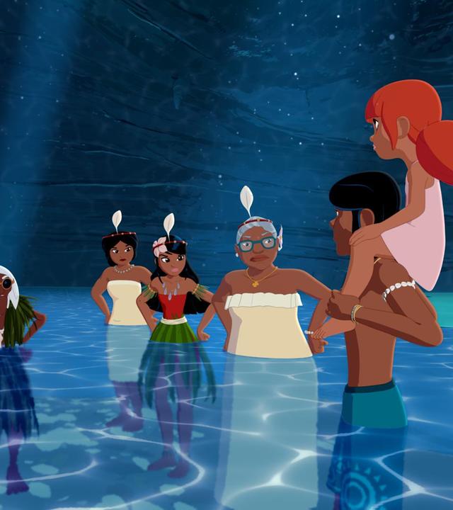 Ramana, Maeva, Timeti und Faratina stehen im halbhohen Wasser einer Unterwasserhöhle und schauen empört zu Auru und Marina. Auru trägt Marina auf seinen Schultern.