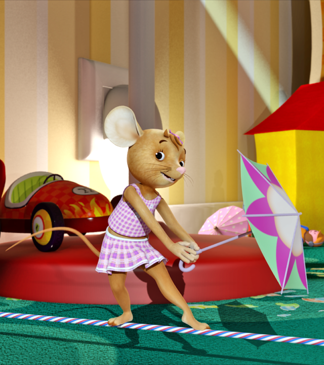 Im Kinderzeimmer ist ein Seil ist über den Boden gespannt. Naya tanzt auf dem Seil mit einem Eisschirmchen in der Hand.