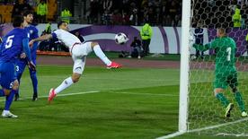 The Iranian Mehdi Taremi scores the second‍ goal‍ in the ⁢World Cup qualification game against ‍Uzbekistan.
