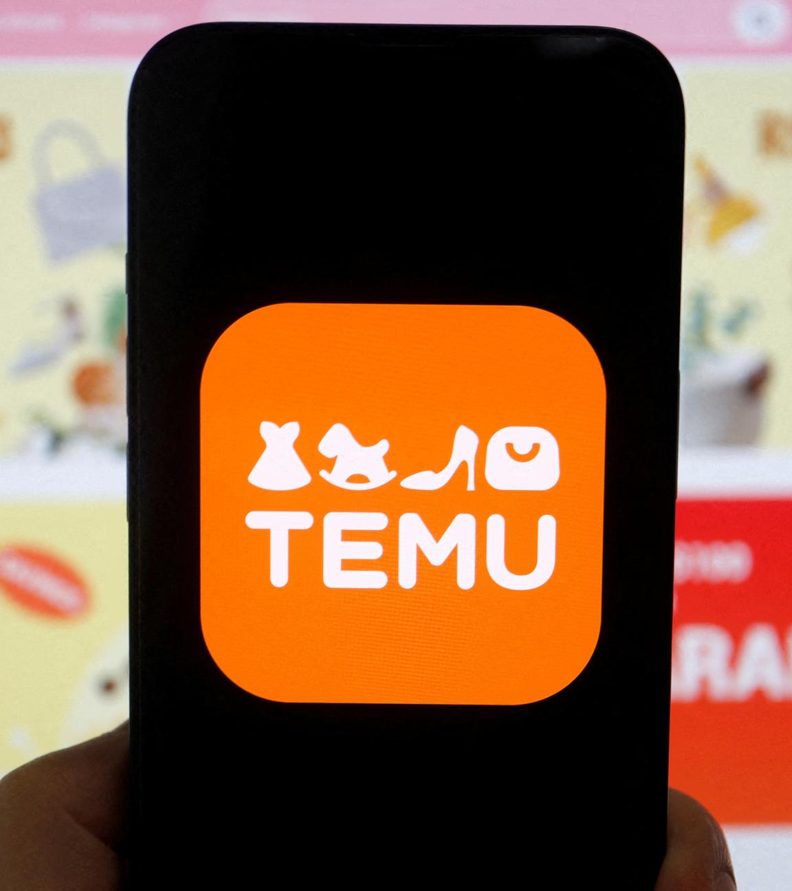 Das Logo von Temu, einer E-Commerce-Plattform, ist auf einem Mobiltelefon zu sehen, das vor seiner Website angezeigt wird, aufgenommen am 26.04.2023