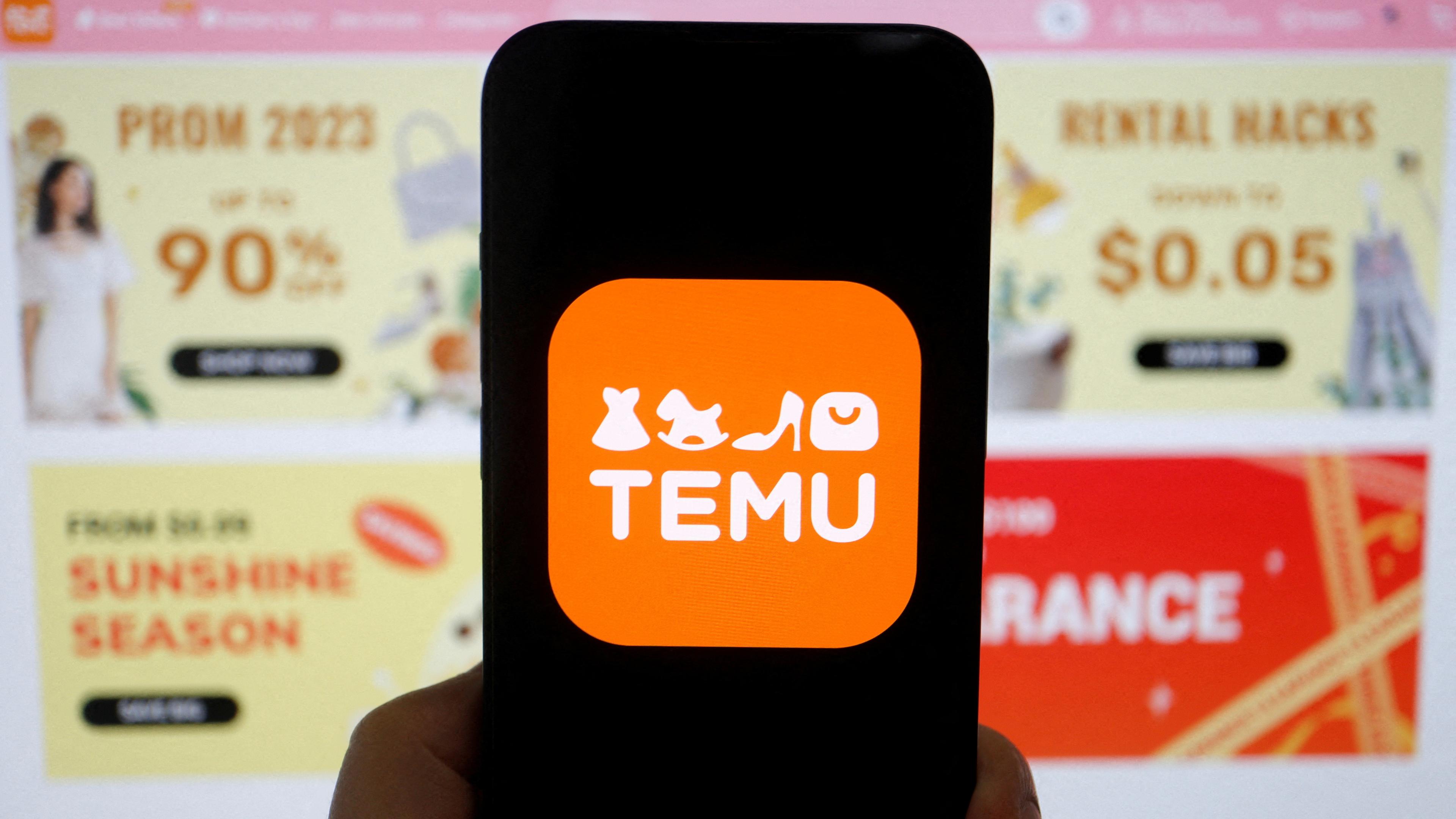 Das Logo von Temu, einer E-Commerce-Plattform, ist auf einem Mobiltelefon zu sehen, das vor seiner Website angezeigt wird, aufgenommen am 26.04.2023