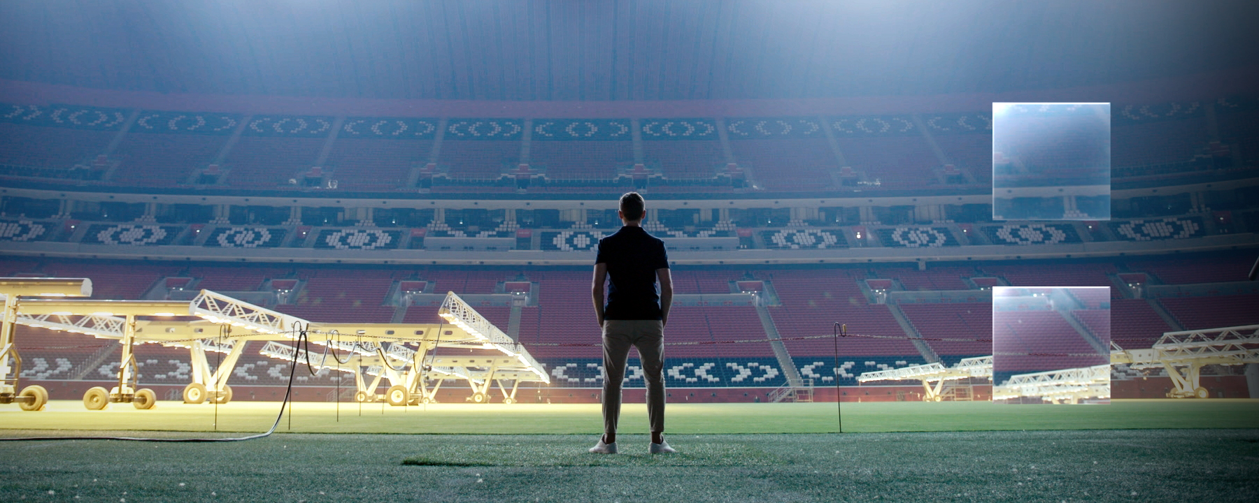 "ZDFzeit: Geheimsache Katar": Blick in ein leeres, hell beleuchtetes Fußballstadion. In der Mitte sind die dunklen Umrisse eines Menschen zu erkennen, der dem Betrachter den Rücken zukehrt