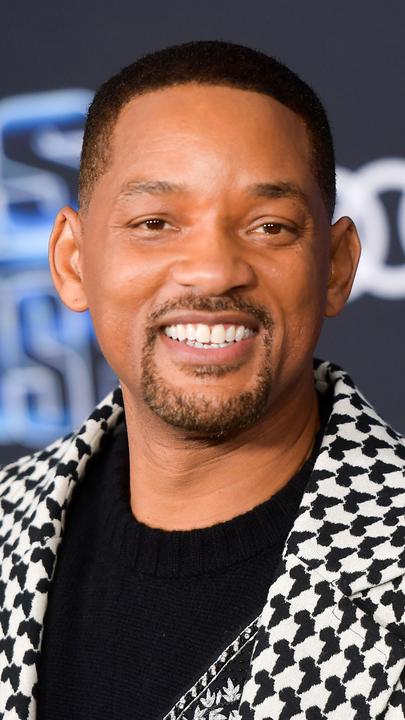 "The True Story of Will Smith": Nahaufnahme von Will Smith. Er trägt ein Hahnentritt-Sakko und lächelt in die Kamera.