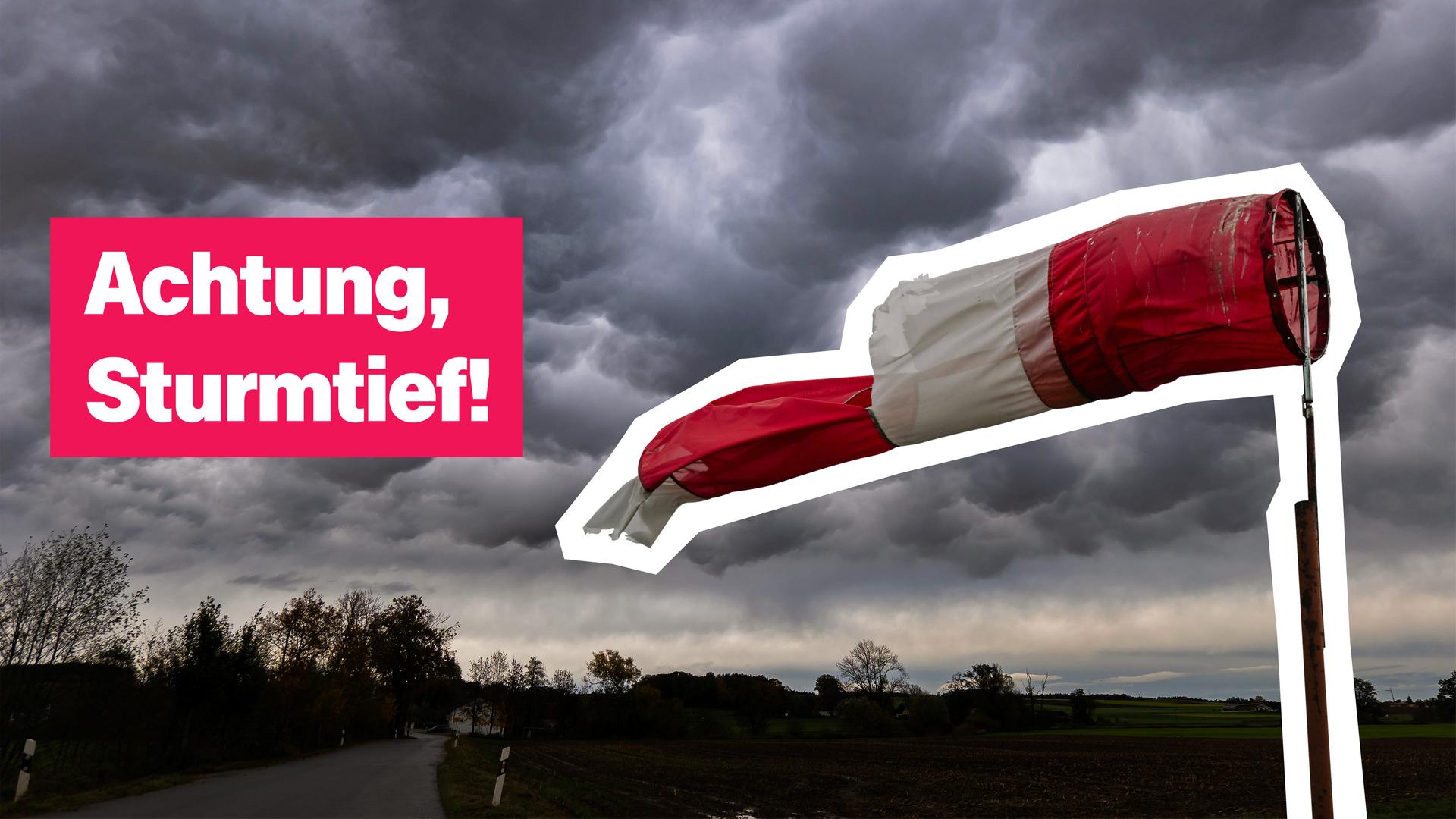 Eine Windfahne weht im Wind, am Himmel sind dunkle Wolken. 