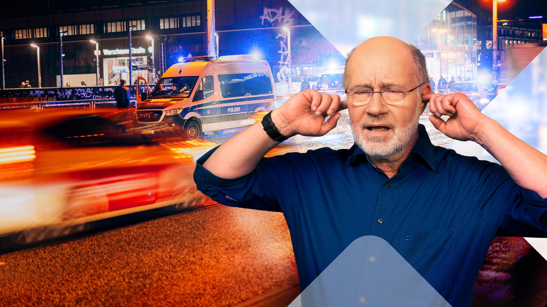 Harald Lesch hält sich die Ohren zu - auf Straße mit Einsatzfahrzeugen.