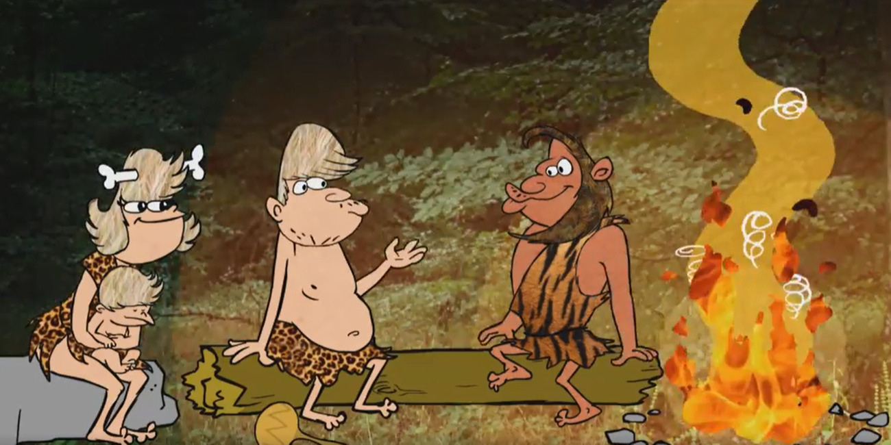 Höhlenmenschen die zusammen am Feuer sitzen