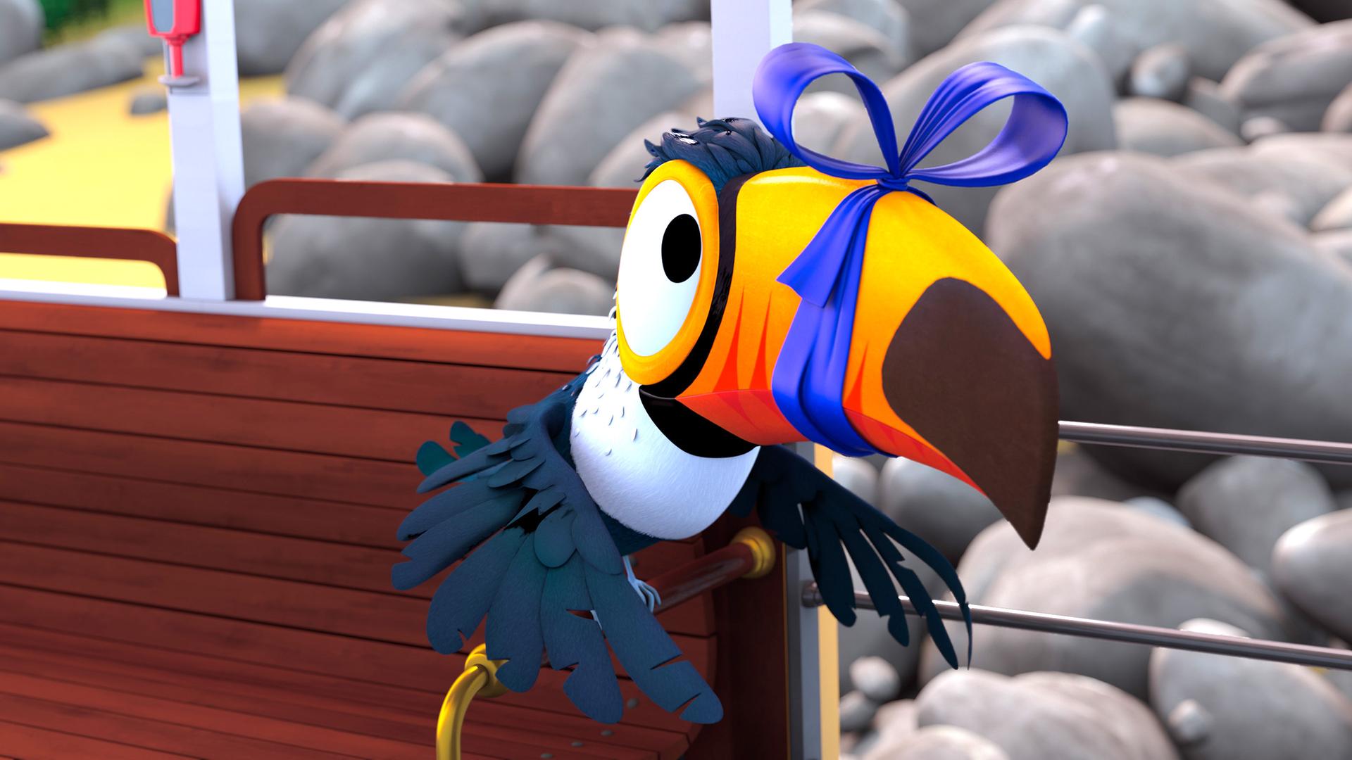 Tukan Toni hat seinen Schnabel mit einer blauen Schleife zugebunden.