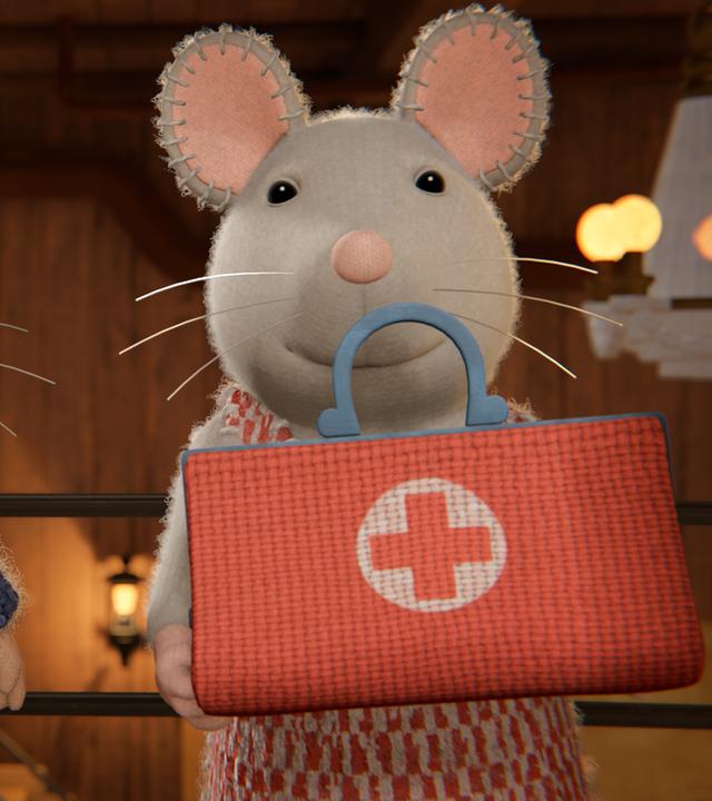 Sam und Julia stehen nebeneinander im Treppenhaus. Julia hat einen Arztkoffer mit einem roten Kreuz darauf in den Händen. Beide schauen freundlich nach vorne.