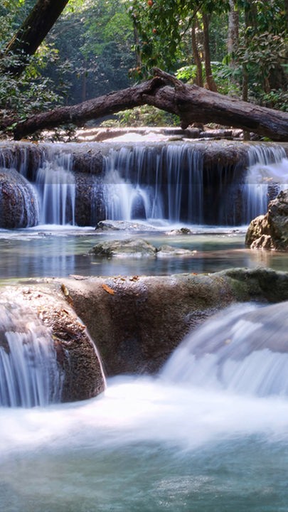 beautiful waterfall cascades in erawan kanachanburi thailand