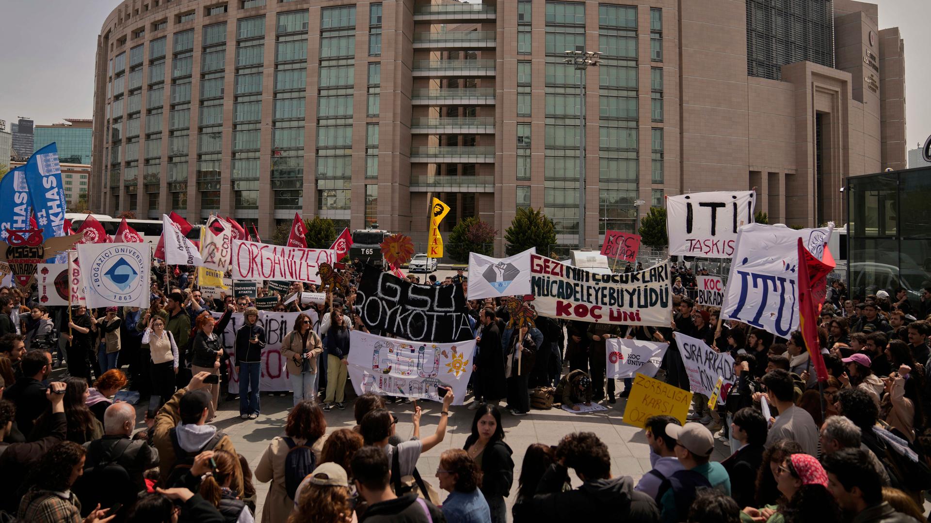 People gather to protest outside Caglayan courthouse, in Istanbul, Turkey.