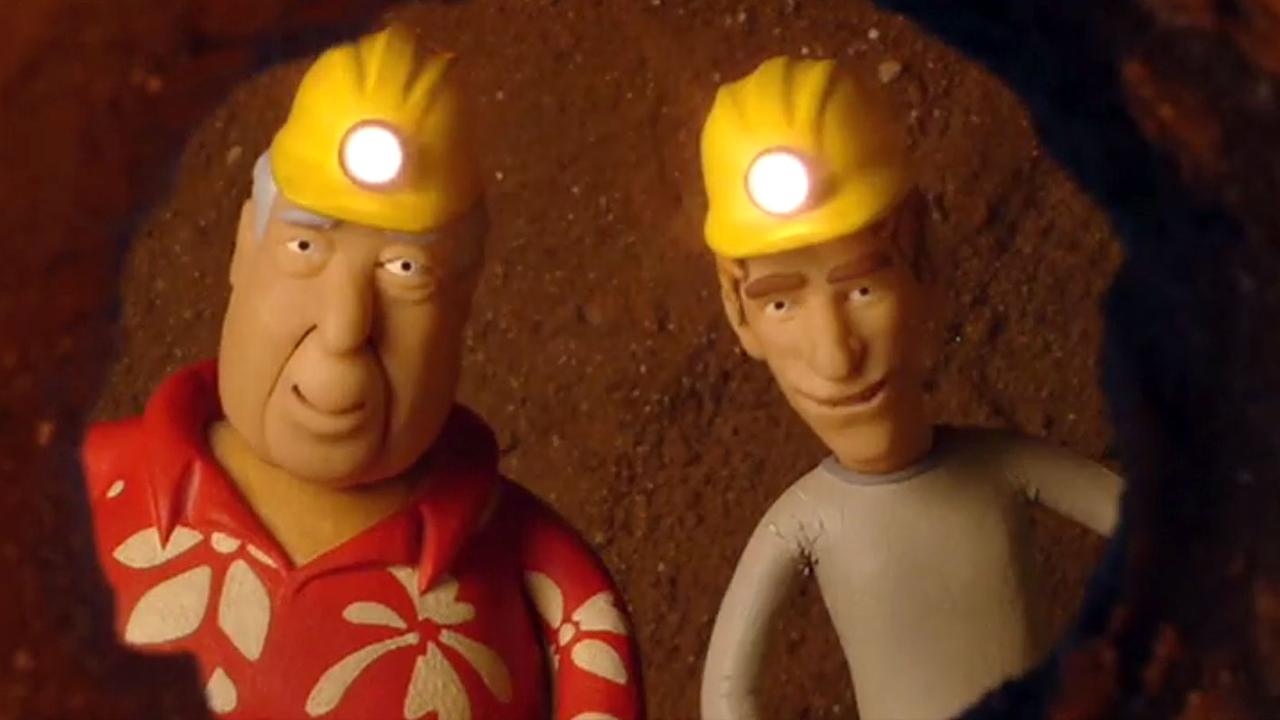 Fritz und Herr Paschulke unter der Erde mit Schutzhelmen.