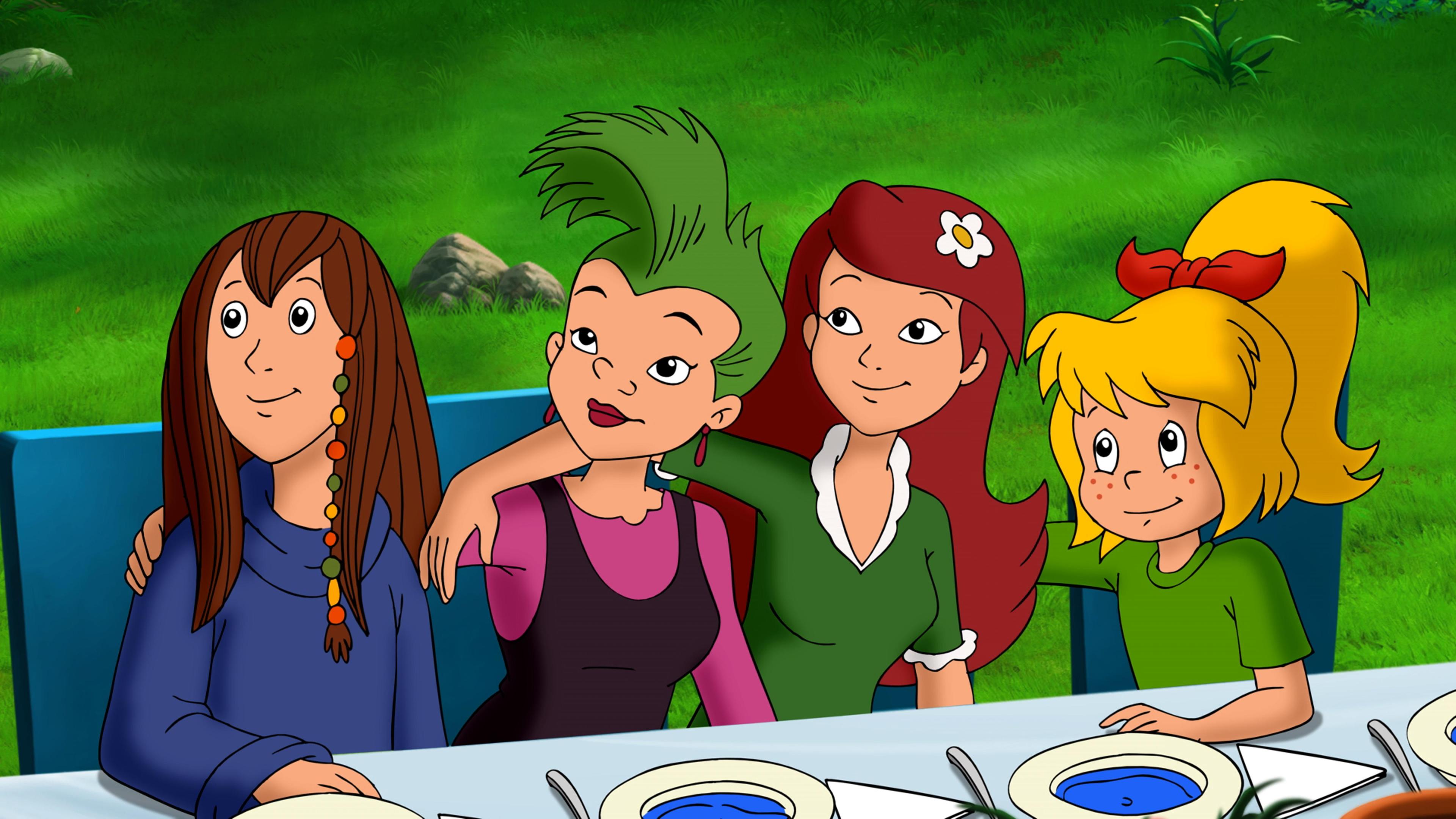 Die Junghexen mit Bibi Blocksberg sitzen erwartungsvoll vor ihren Tellern mit blauer Suppe. 