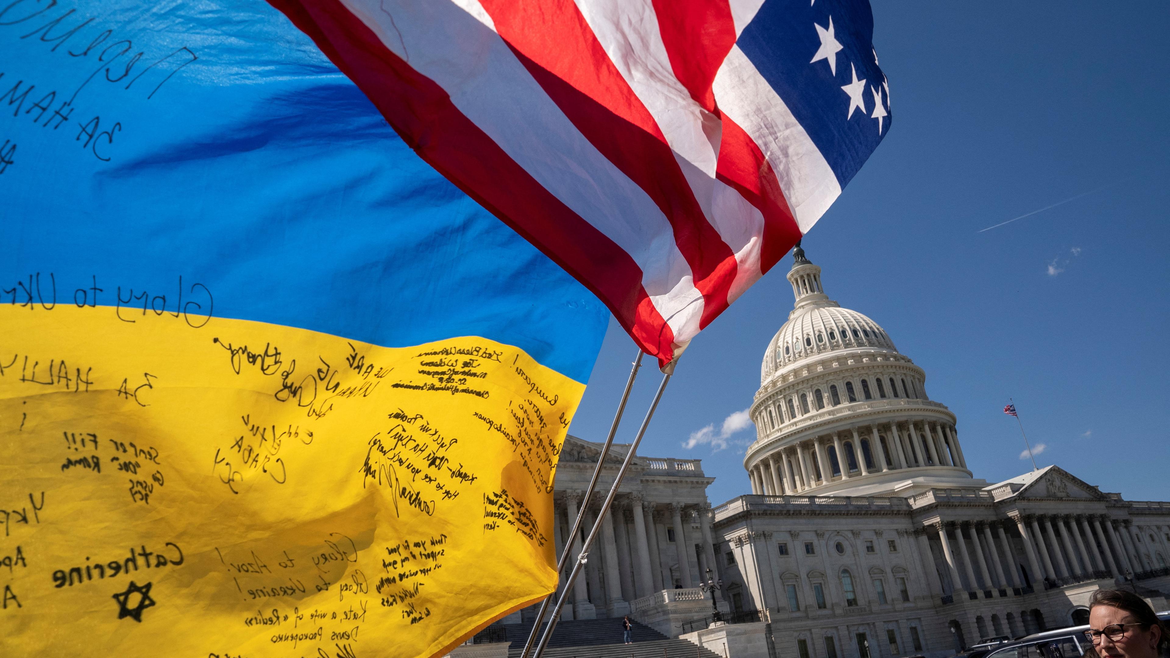 Flags flutter as pro-Ukrainian supporters demonstrate outside the U.S. Capitol after the U.S. House of Representatives voted on legislation providing $95 billion in security assistance to Ukraine, Israel and Taiwan, at Capitol Hill in Washington, U.S., April 20, 2024. 