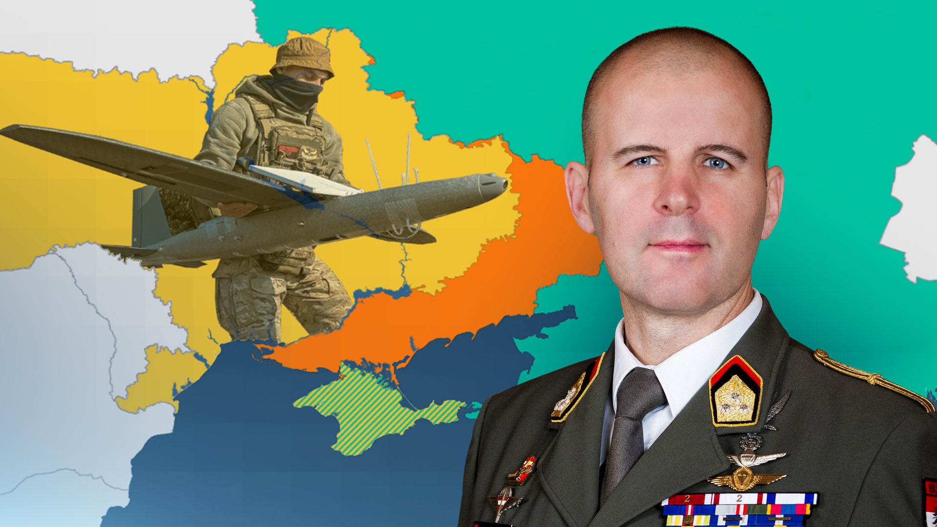 Oberst Reisner vor einer Karte der Ukraine.