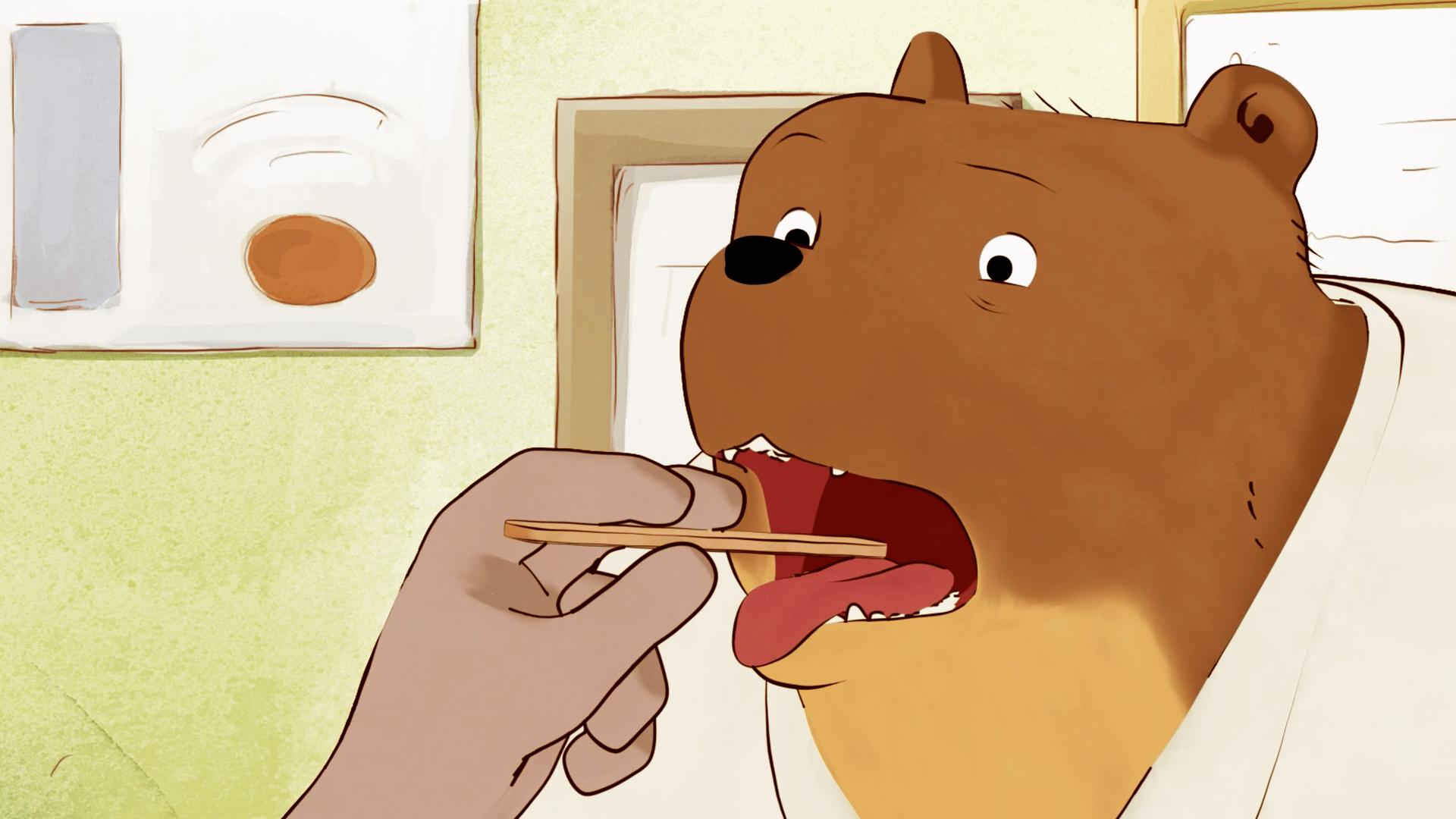 Ernest sperrt den Mund auf und der Arzt drückt mit einem Holzstab die Zunge herunter. Ernest schaut unglücklich drein.