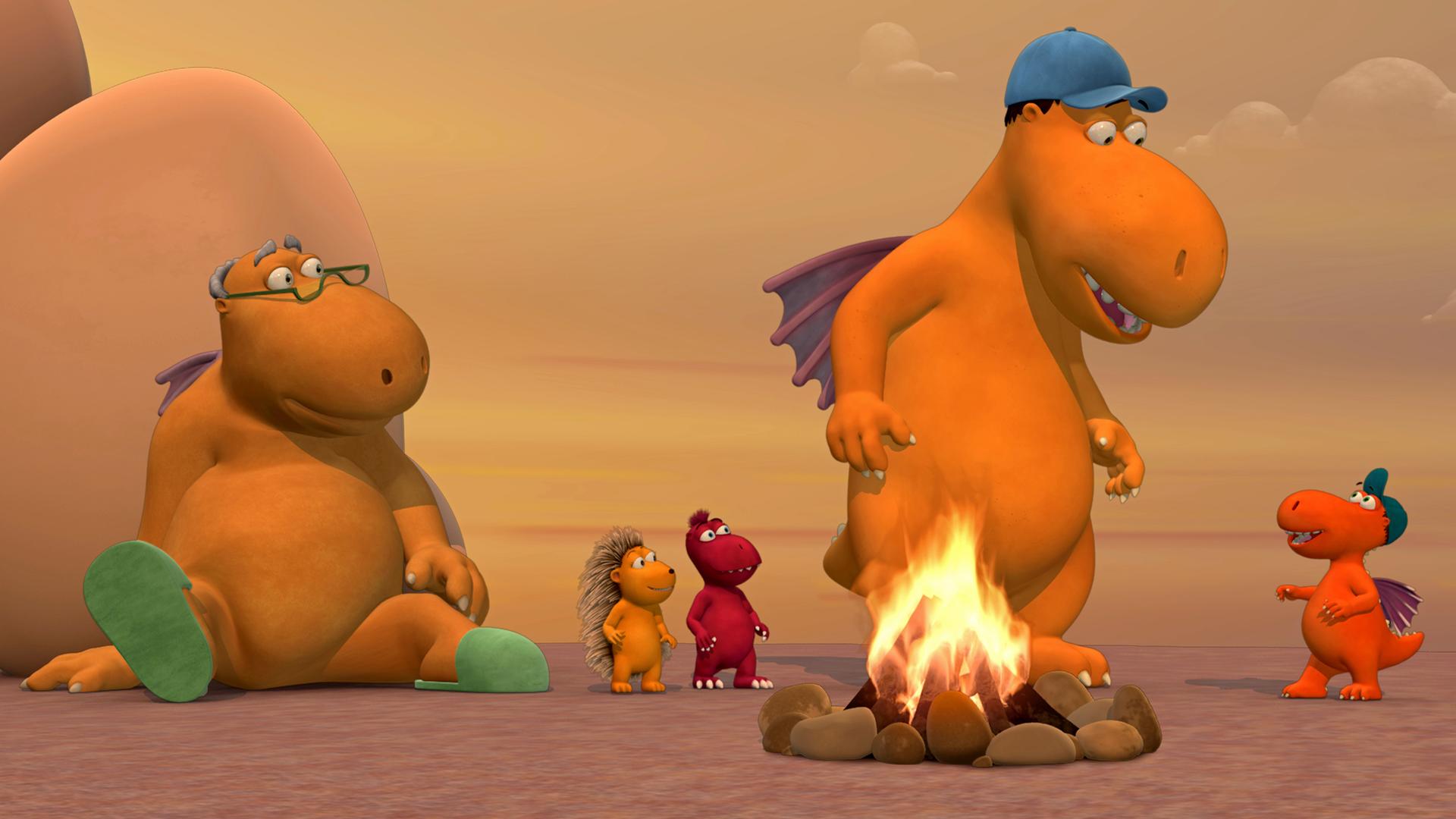 Magnus, Opa, Kokosnuss, Matilda und Oskar sind um ein Lagerfeuer versammelt. Magnus schaut zu Kokosnuss herunter.