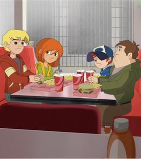Die Freunde sitzen in einem Fastfoodrestaurant und essen.