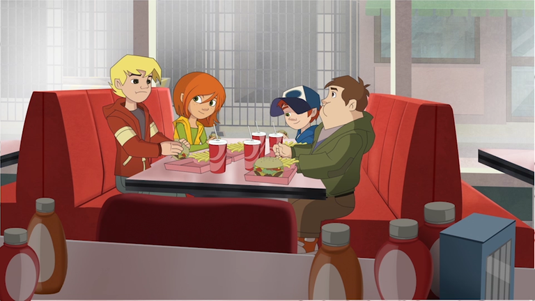 Die Freunde sitzen in einem Fastfoodrestaurant und essen.