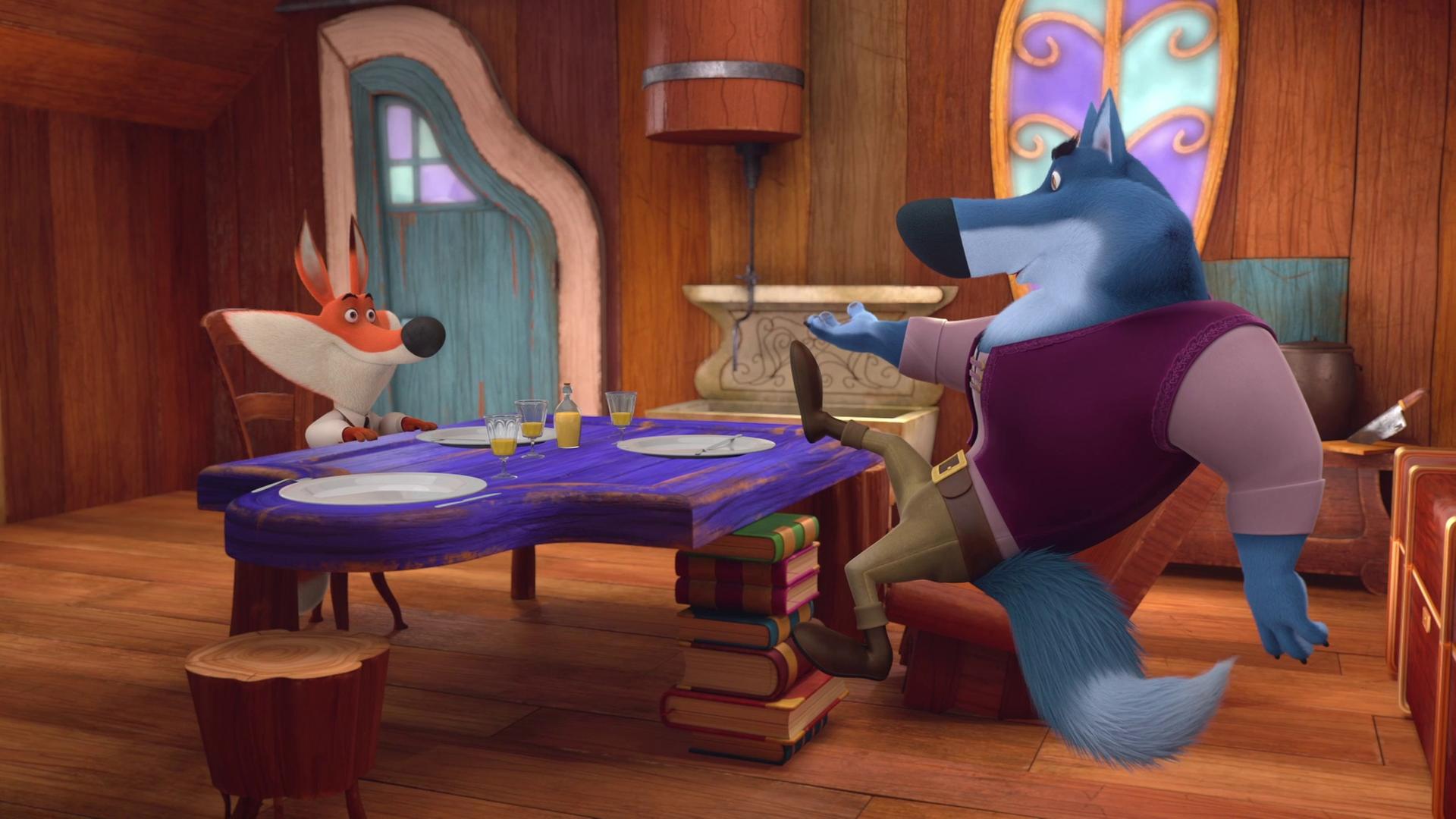 Volpek (links) wurde vom großen bösen Wolf (rechts) zu sich nach Hause eingeladen. Beide sitzen am gedeckten Esstisch und Volpek hört dem Wolf gespannt zu, der lässig seinen Fuß auf dem Tisch abgestützt hat.