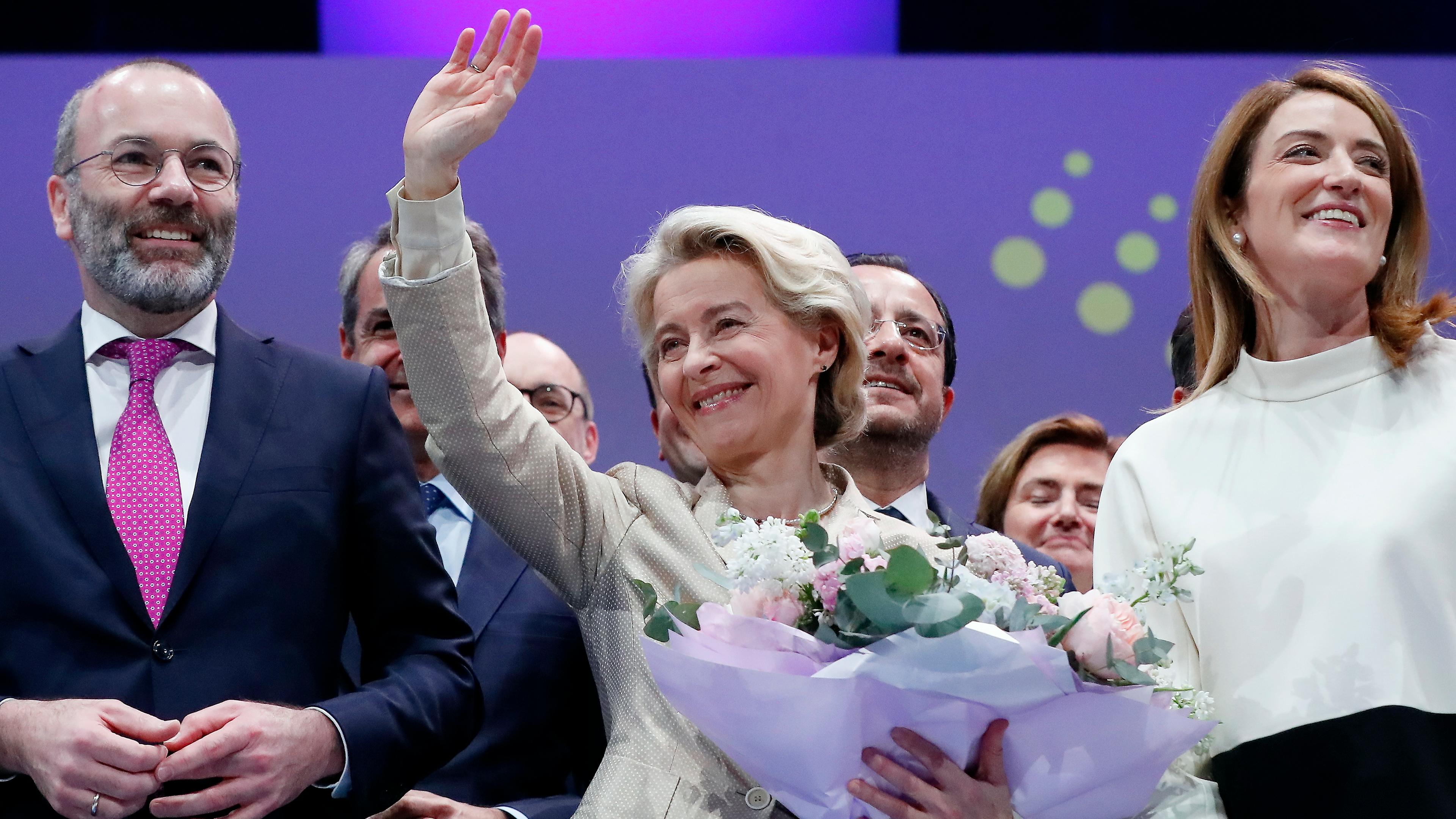 European Commission President Ursula von der Leyen (C), the EPP candidate for the same position, celebrates with EPP president Manfred Weber (L) and European Parliament President Roberta Metsola (R), after winning the ballot at the European People's Party Congress in Bucharest, Romania, 07 March 2024