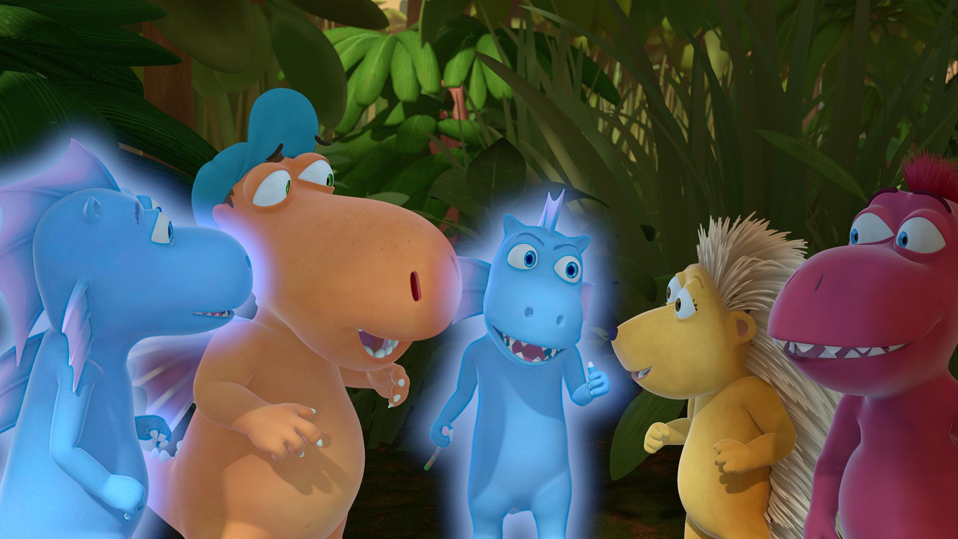 Kokosnuss (links), Matilda und Oskas (rechts) stehen in einem Kreise mit zwei Wasserdrachen und planen etwas.