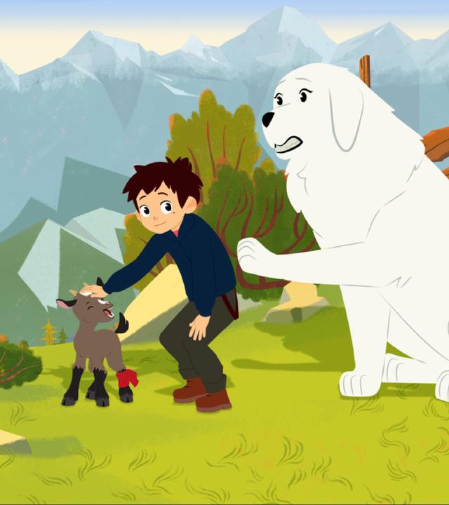 Sebastian streichelt ein Zicklein. Belle sitzt daneben und hebt eine Pfote.