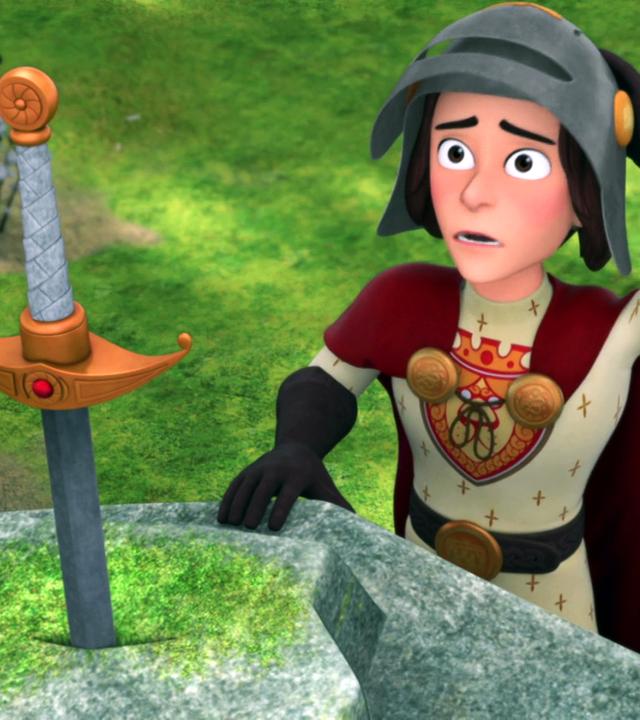 König Richard steht vor einem Felsen, in dem ein Schwert steckt. Er trägt einen Helm, mit der linken Hand greift er sich an den Kopf und sieht dabei verzweifelt aus.